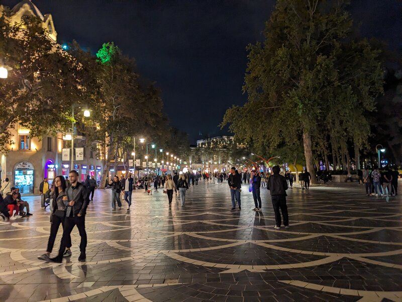 People walking around the night streets