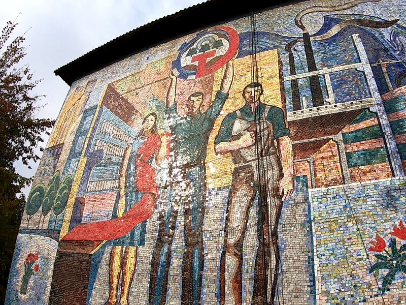 A fading mosaic on an old building