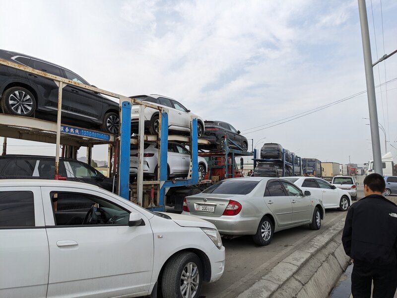The border full with trucks carrying cars