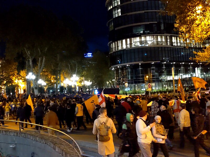 Protesters marching at night