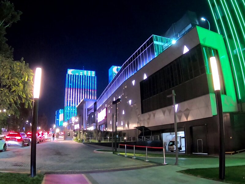 A fancy street at night outside the shopping mall